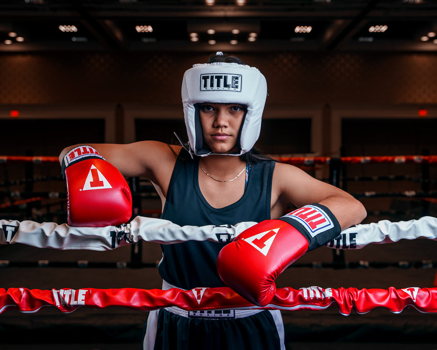 variant:white::TITLE Boxing USA Boxing Competition Headgear - Open Face kid standing in the ring hands on rope