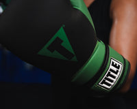 variant:Black/Blue::TITLE Boxing Conquest Training Boxing Gloves closeup on glove on fighter's hand
