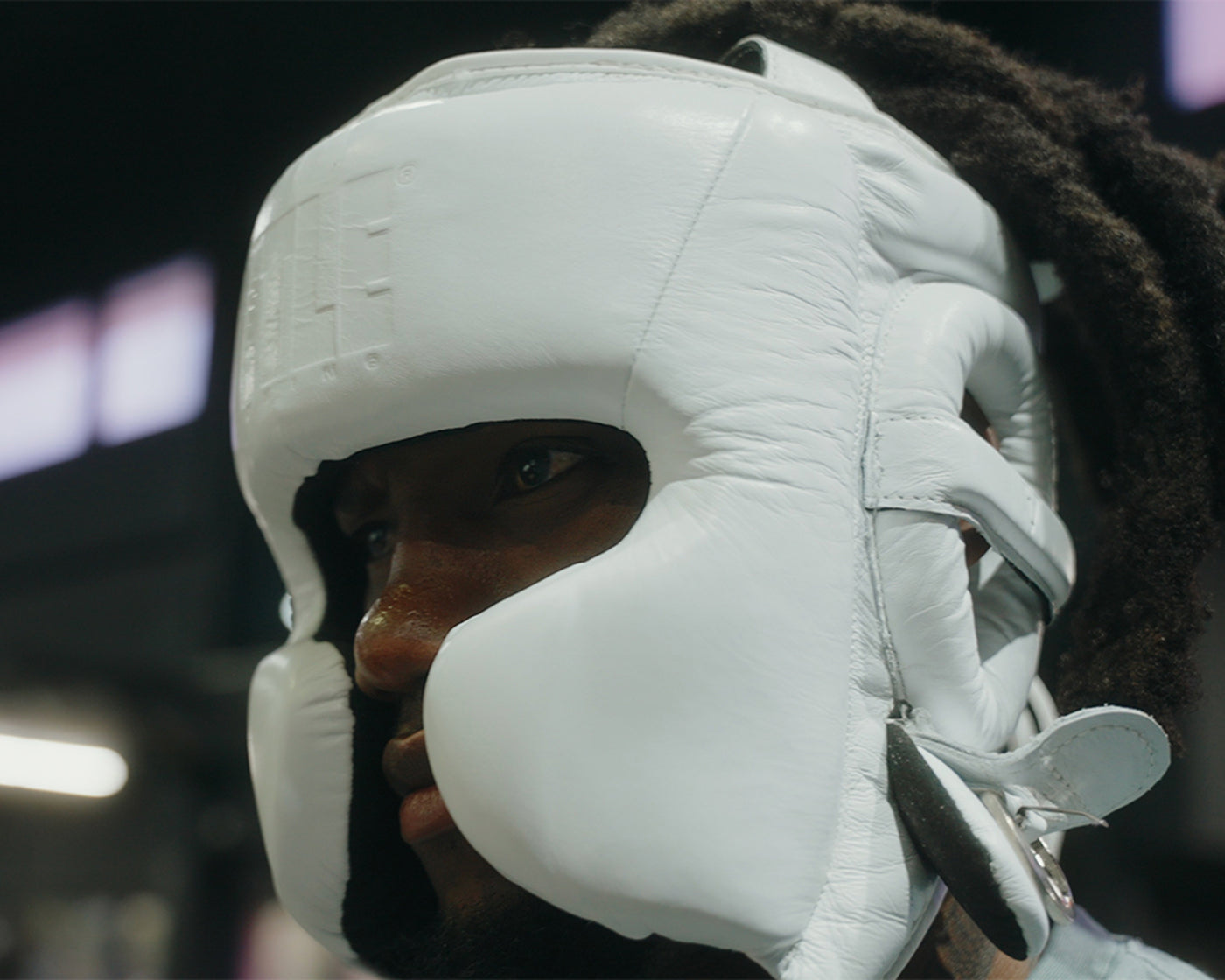 variant:white::TITLE Boxing Pro Sparring Headgear closeup on boxer's head side view