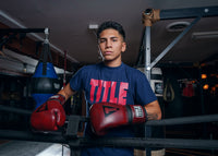 variant:lifestyle::TITLE Boxing Blood Red Leather Training Gloves kid on boxing ropes