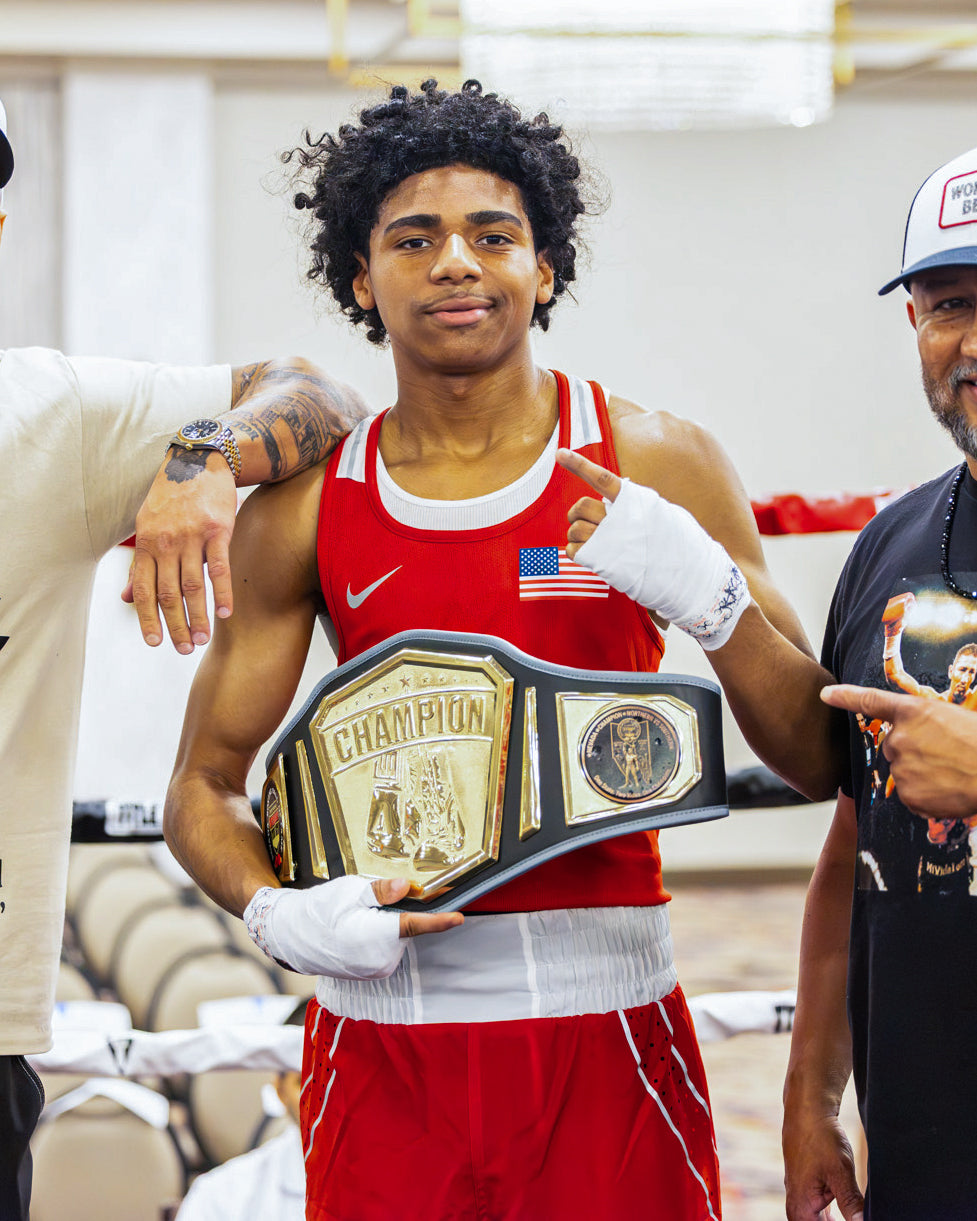 variant:lifestyle::TITLE Boxing Undisputed Championship Belt being presented to fighter
