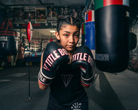 variant:Black/Red::TITLE Boxing Gel Soft Strike Bag Gloves girl posing