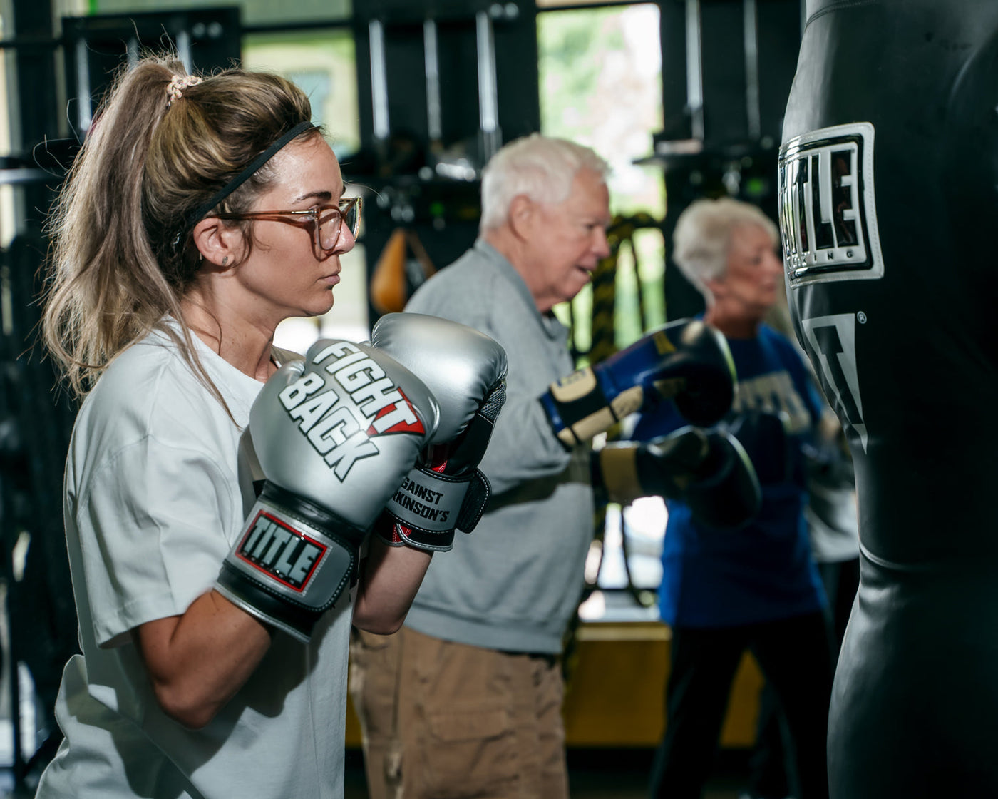 variant:lifestyle::TITLE Boxing Fight Back Boxing Gloves side view of class