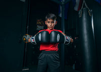 variant:black::Fighting Fury Professional Training Gloves kid hands together 
