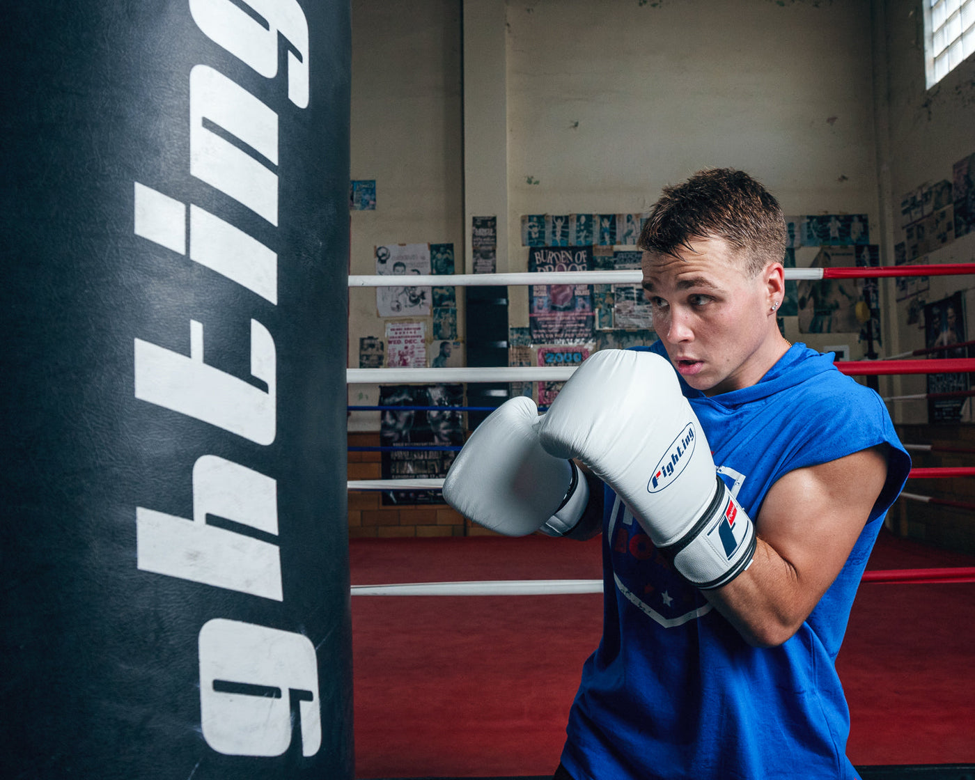 variant:white::Fighting Fury Professional Training Gloves kid hitting bag