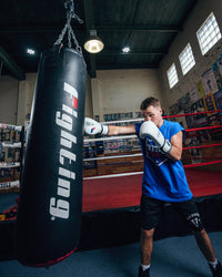 variant:white::Fighting Fury Professional Training Gloves kid long left jab view