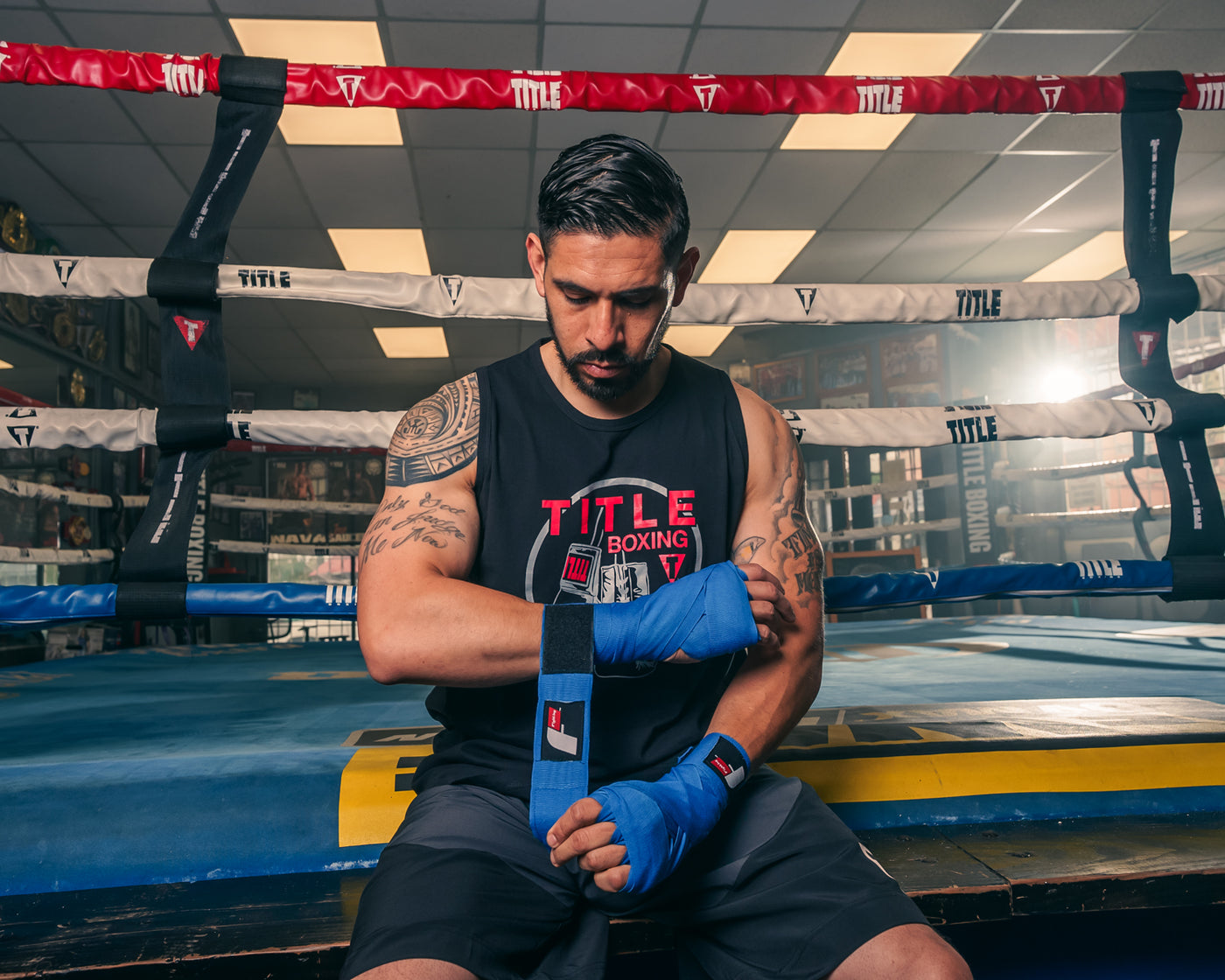 variant:Royal::Fighting Semi-Elastic 180" Hand Wraps guy on ring wrapping hands