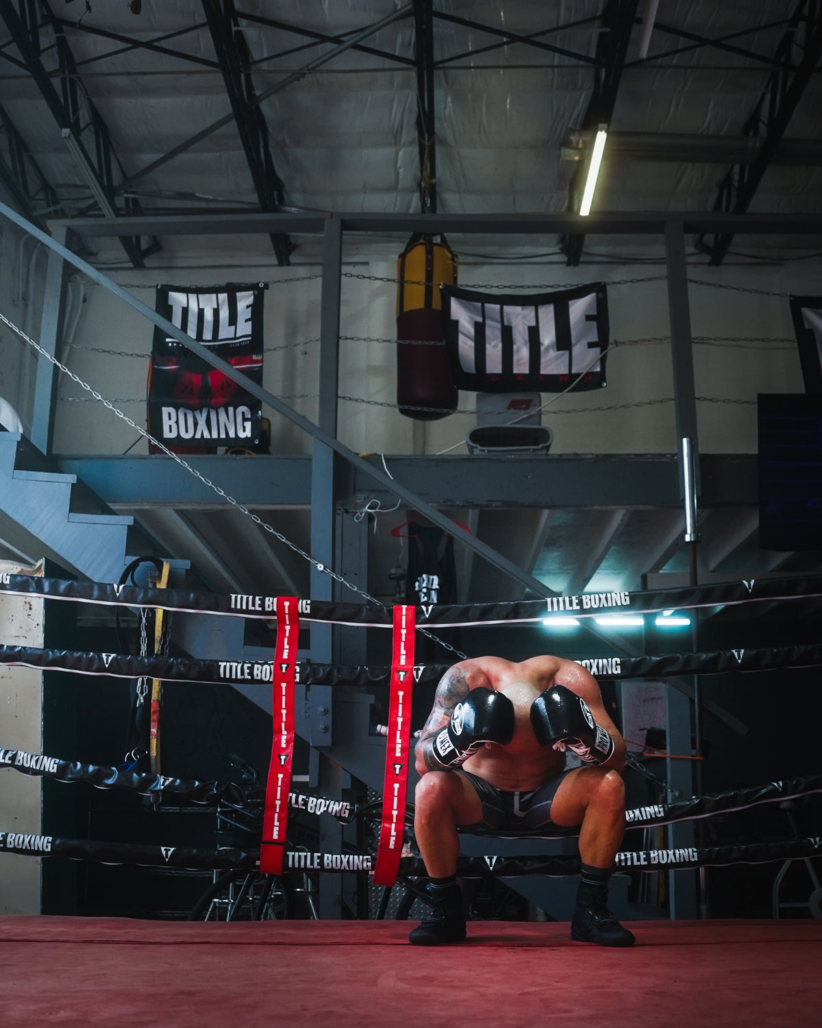 variant:lifestyle::TITLE Boxing Big Logo Banner on wall behind boxing ring