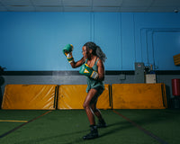 variant:green/gold::TITLE Boxing Gel World V2T Bag Gloves boxing stance