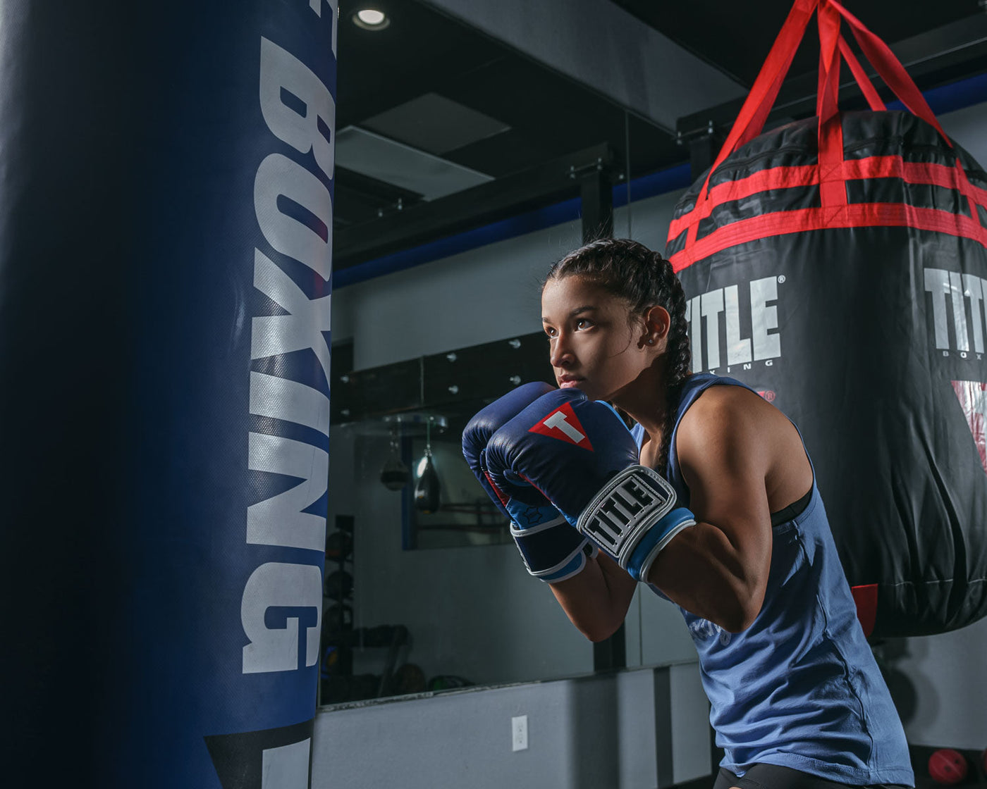 variant:navy/navy::TITLE Boxing Gel World V2T Bag Gloves boxing stance with bag