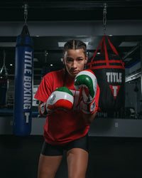 variant:lifestyle::TITLE Boxing Infused Foam EI Combat Mexico Training Gloves girl boxing pose