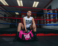 variant:pink::TITLE Boxing Individual Sport Bag pulling out gloves out of bag