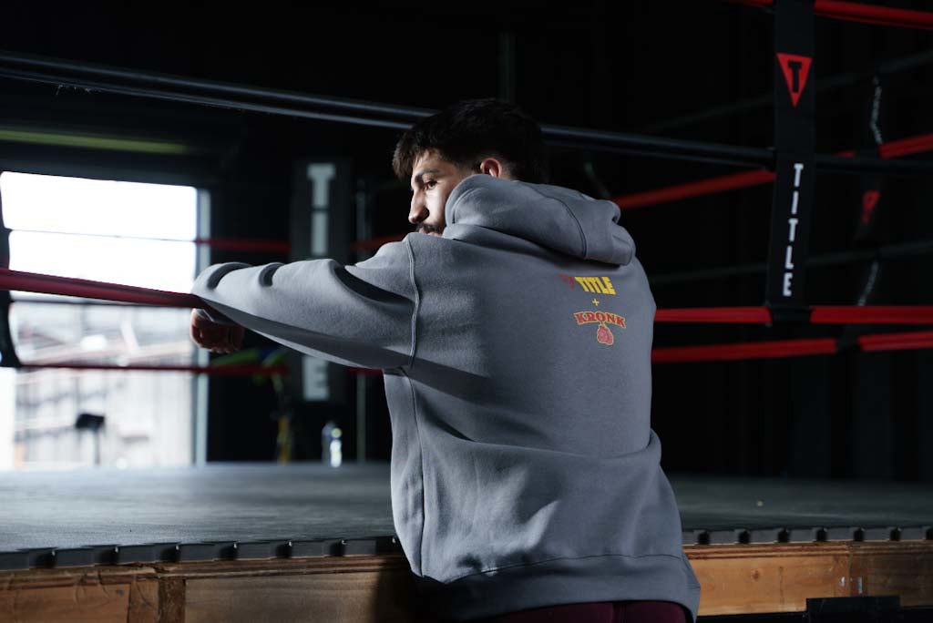 variant:Dark Grey::TITLE Boxing Legacy KRONK Training Camp Hoodie guy with back turned