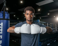variant:white::TITLE Boxing Ko-Vert Bag Gloves guy posing with boxing gloves