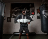 variant:White::TITLE Boxing Ko-Vert Training Gloves man wearing gloves in gym