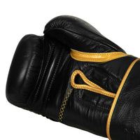 variant:black/gold::TITLE Boxing Momentum Pro Bag Gloves single glove palm view closeup