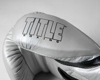 variant:silver/black::TITLE Boxing Momentum Pro Bag Gloves closeup of logo on thumb