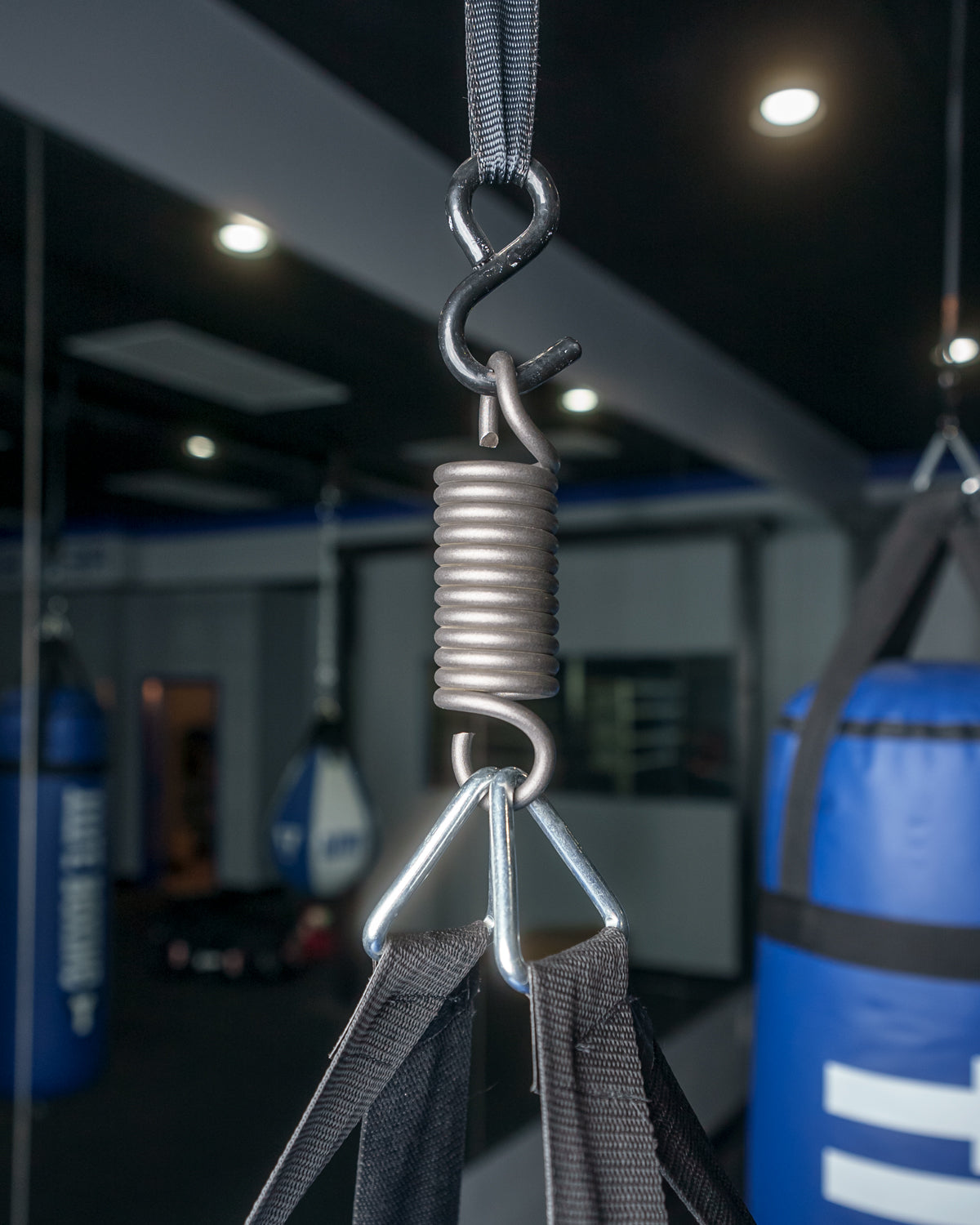 variant:lifestyle::TITLE Boxing Heavy Bag Hanger and Spring Bundle closeup of spring on bag