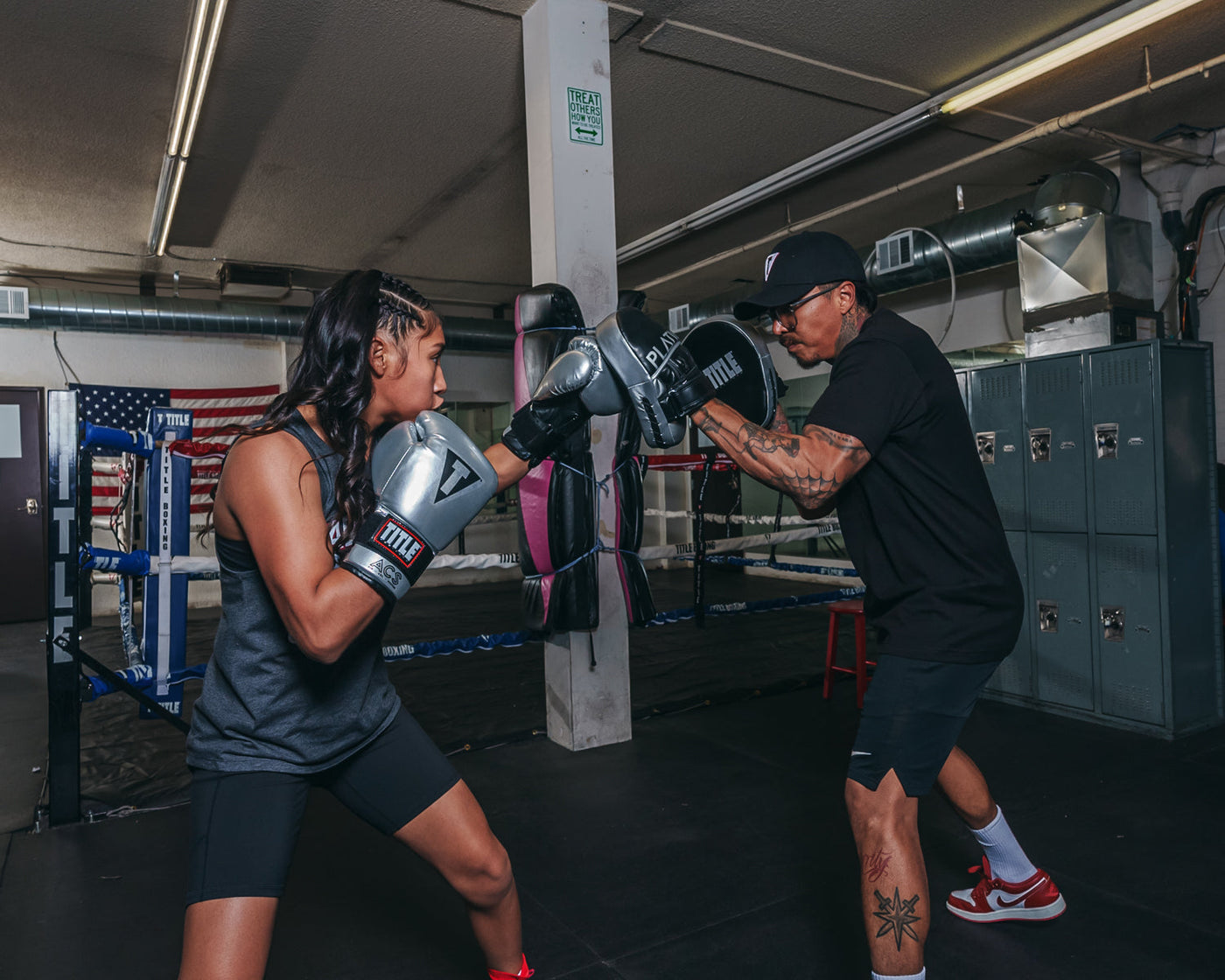 variant:lifestyle::TITLE Platinum Prolific Punch Mitts girl coach mitts