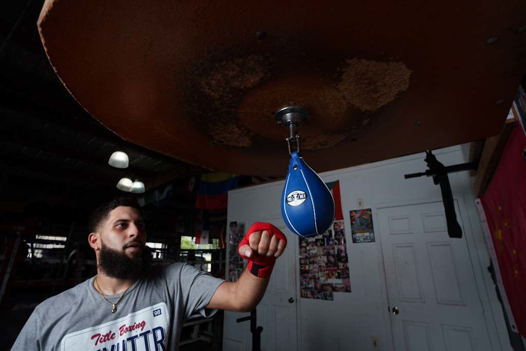 variant:4" x 7"::Pro Mex Professional Speed Bag V2.0 guy hitting bag front shot