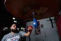 variant:4" x 7"::Pro Mex Professional Speed Bag V2.0 guy hitting bag front shot