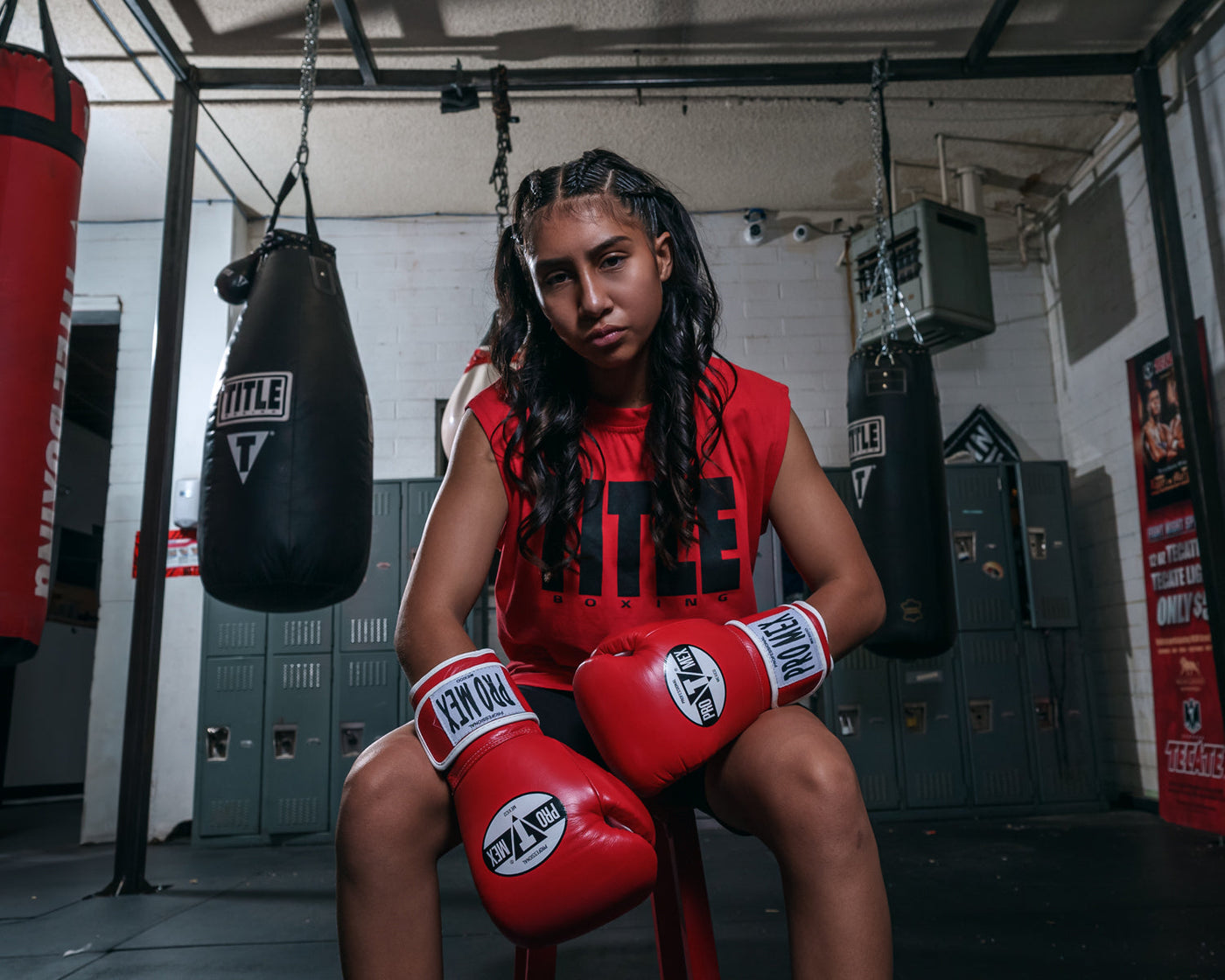 variant:red::Pro Mex Professional Training Gloves 3.0 girl sitting down