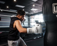 variant:white/black::Pro Mex Professional Lace Sparring Gloves V3.0 kid kitting bag right jab