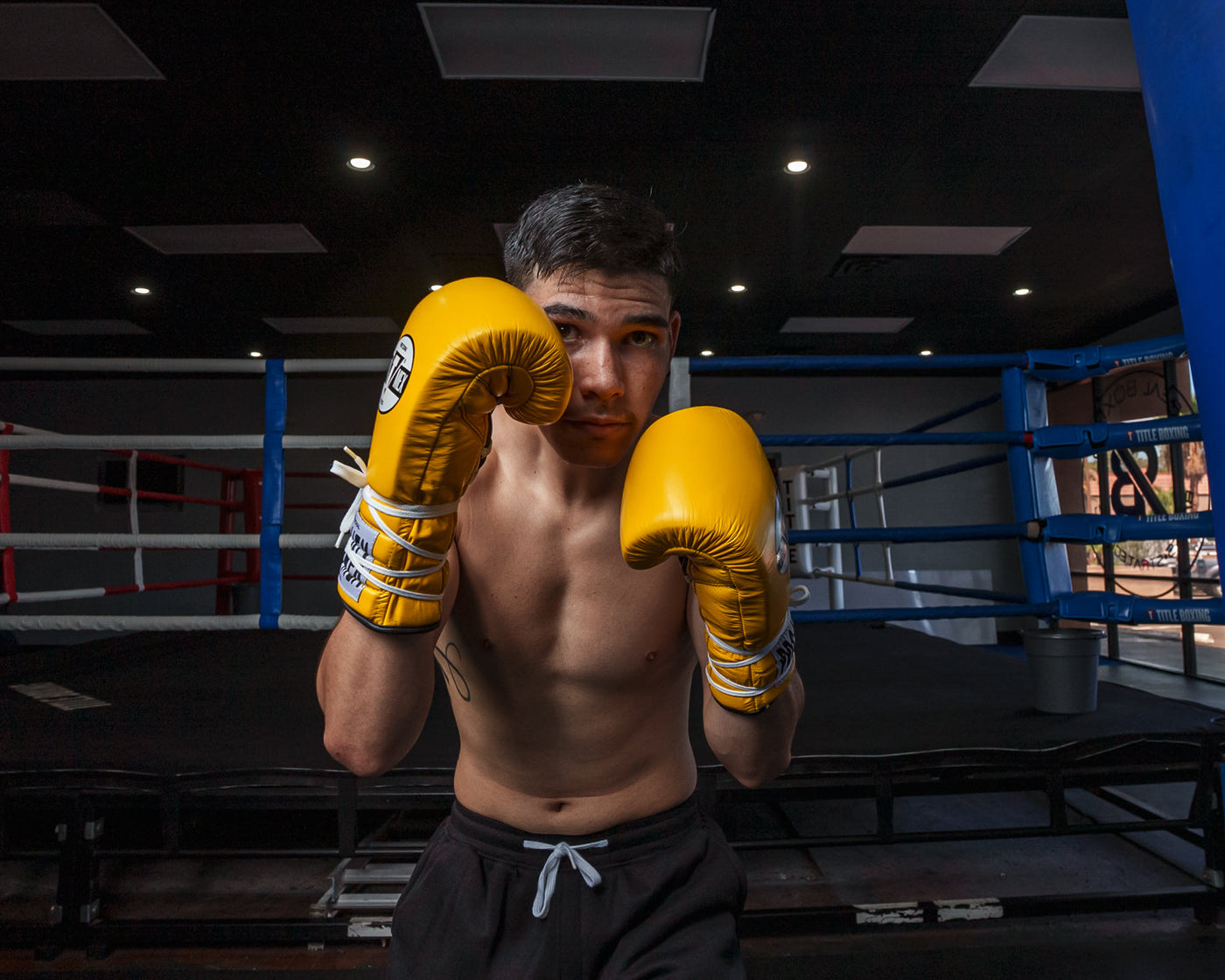variant:Yellow/Black::Pro Mex Professional Lace Sparring Gloves V3.0 guy boxing pose