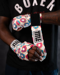 variant:donuts::TITLE Boxing Print Mexican Style 180" Hand Wraps being wrapped on boxer's hands