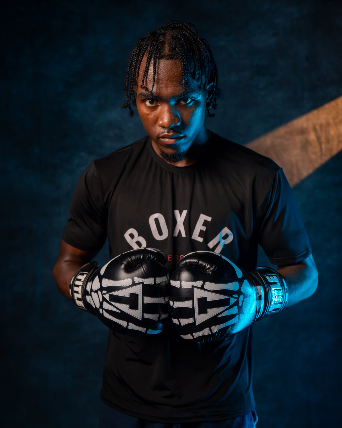 variant:black::TITLE Boxing Skeleton Hand Bag Boxing Gloves on boxer's hands