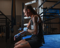 variant:columbia blue::TITLE Boxing Select 180" Semi Elastic Mexican Hand Wraps girl putting on wraps