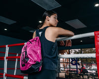 variant:pink::TITLE Boxing Bruiser Gym Sack girl wearing bag