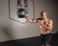variant:12 lbs::TITLE Boxing Rubber Medicine Ball guy throwing ball