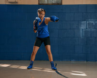 variant:Blue::TITLE Boxing Speed-Flex Encore Mid-Top Shoes girl boxing pose