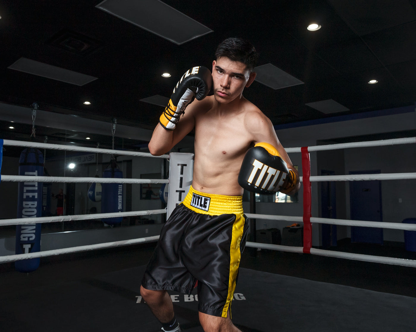 variant:black/gold::TITLE Boxing Edge Boxing Trunks 2.0 guy in ring club