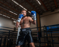 variant:black::TITLE Boxing Edge Boxing Trunks 2.0 guy shadow boxing