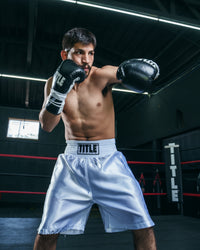 variant:White::TITLE Boxing Edge Boxing Trunks 2.0 guy in trunks