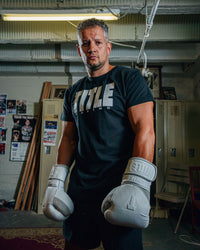 variant:Black/Grey::TITLE Boxing Iconic Block Tee man in tee with gloves