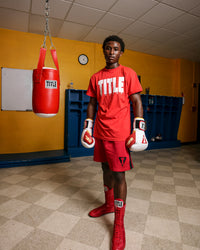 variant:Red/White::TITLE Boxing Iconic Block Tee man posing in tee