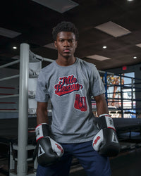 variant:grey::TITLE Boxing Classic Script Performance Tee kid sitting on ring