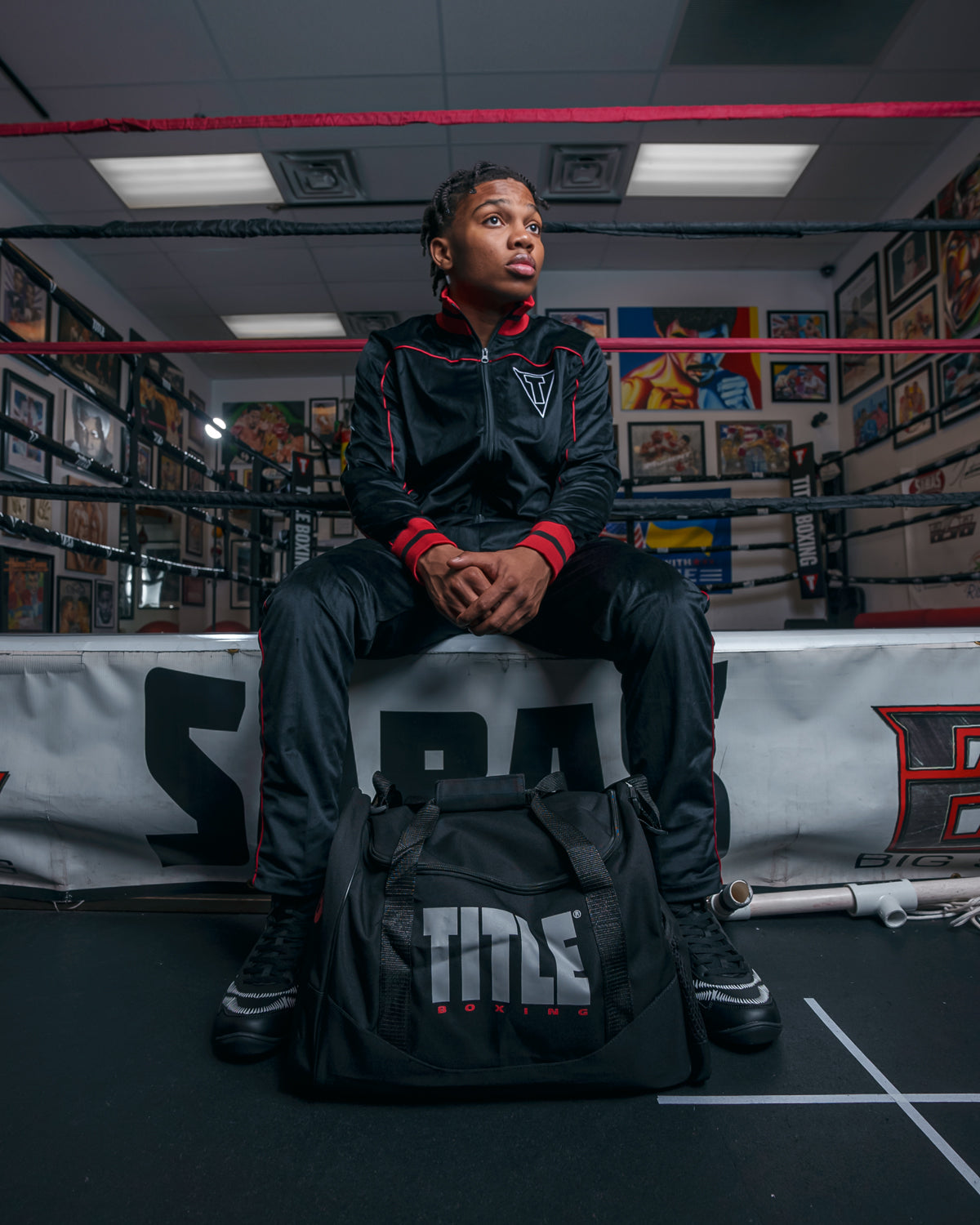 variant:lifestyle::black sports equipment bag next to boxing ring