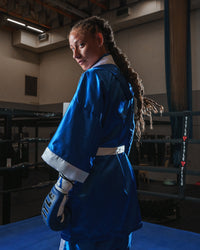 variant:blue/white::TITLE Boxing Stock Fingertip Robe 2.0 girl in robe looking back