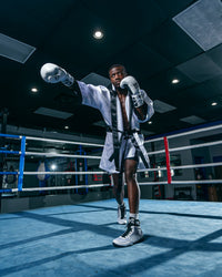 variant:white/black::TITLE Boxing Stock Fingertip Robe 2.0 boxing right jab in ring