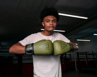 variant:Green/Black::TITLE Boxing Vegan Fitness Bag Gloves boy modeling gloves