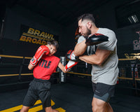 variant:lifestyle::TITLE Boxing Valiant Micro Mitts kid mitting left uppercut