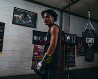 variant:Black/Green::WBC by TITLE Boxing Bag Gloves guy standing looking over shoulder