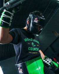 variant:lifestyle::WBC by TITLE Boxing Sparring Gear Bundle headgear on boxer