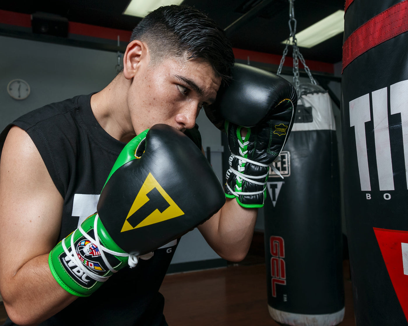 variant:Black/Green::WBC by TITLE Boxing Sparring Gloves boy wearing gloves