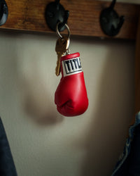 variant:red::TITLE Boxing Excel Glove Keyring hanging on hook