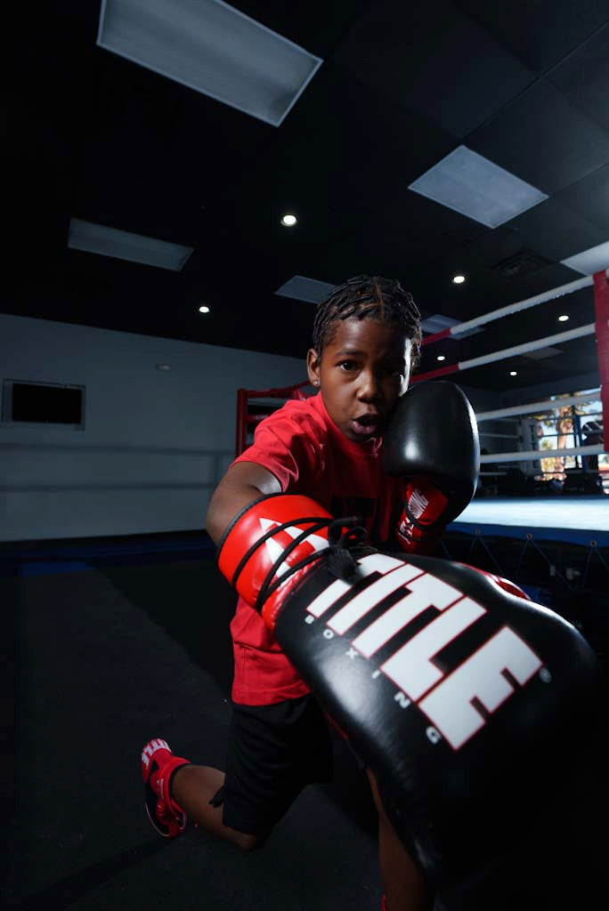 variant:Black/Red/White::TITLE Boxing Pro Style Youth Lace Training Gloves boy throwing right hand